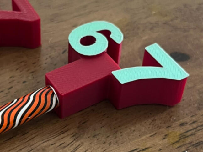 67 pencil topper - £1